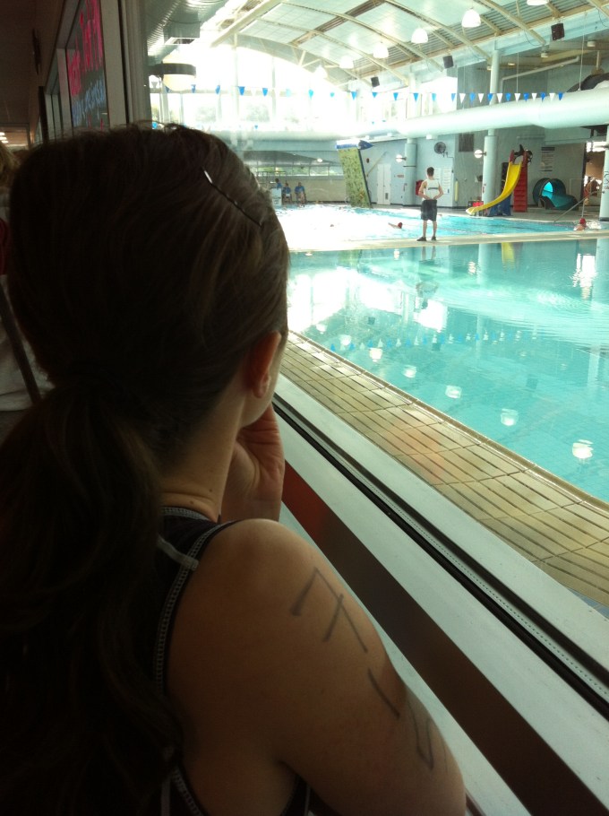 Jenna nervously looking on at the swim start