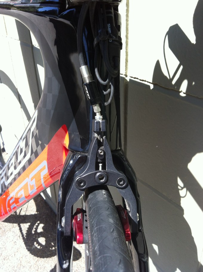 Underneath the brake cover you'll find, you guessed it, the front brake and the Junction box for the shifters.